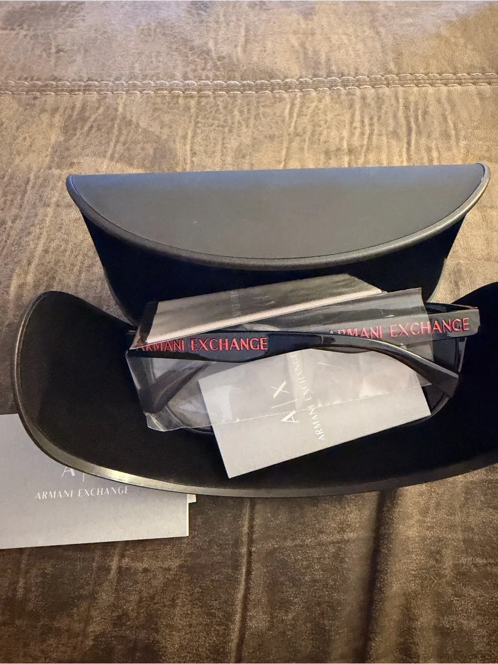 Armani Exchange Black Cat-Eye Sunglasses with Red Logo Accent